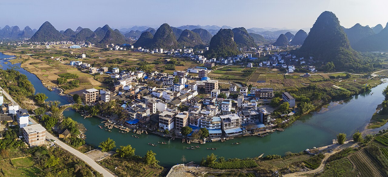 Karst limestone peaks reflecting in the Yulong River in Yangshuo, Guilin